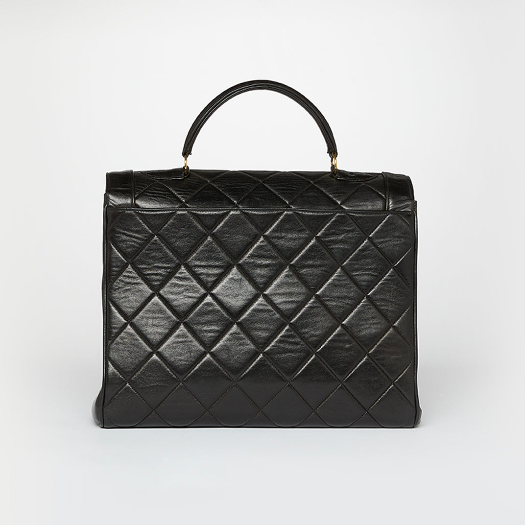 CHANEL Vintage Classic Quilted Top Handle Bag in Black Lambskin COCOON