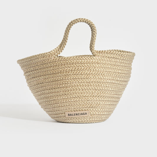 Front view of Balenciaga Ibiza nylon and leather basket bag in beige