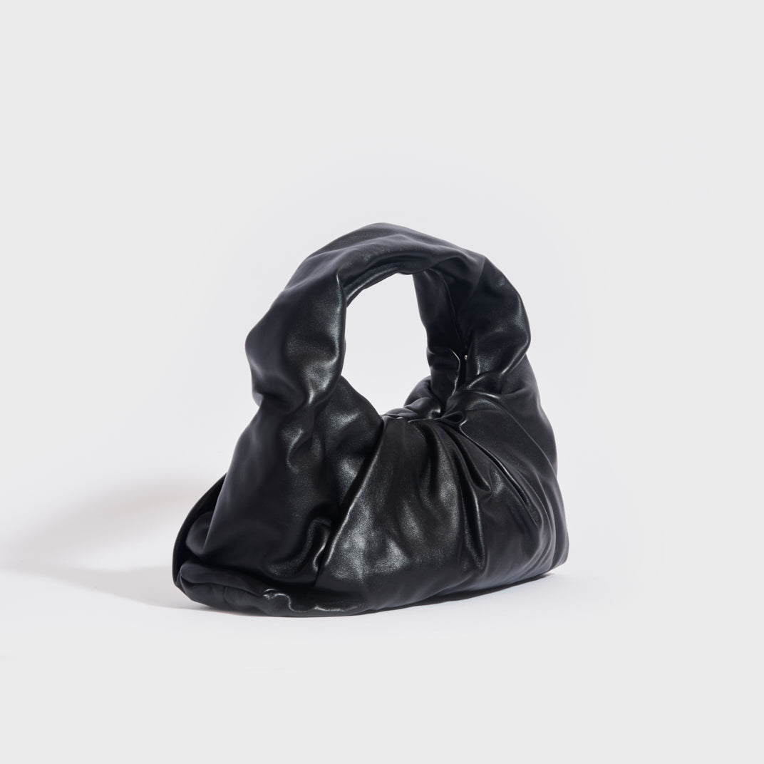 Authentic Bottega Veneta Black Solid Leather Bag on sale at JHROP. Luxury  Designer Consignment Resale @jhrop_official