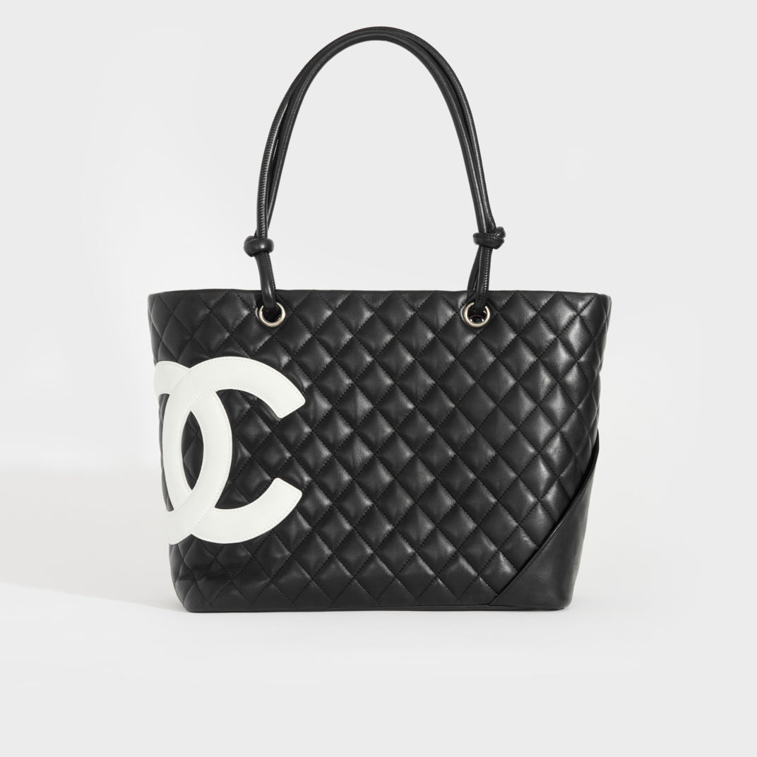 CHANEL EXECUTIVE TOTE BAG black caviar leather with silver tone hardware  detachable shoulder strap two top handles back and front external pockets  with iconic CC turn lock closure black snap closure at
