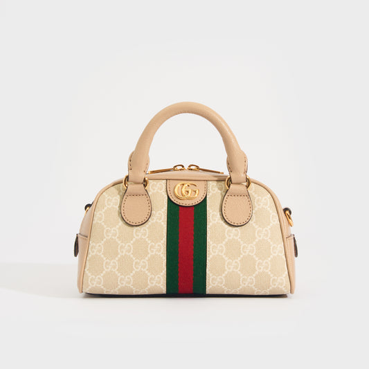 Front view of the GUCCI Ophidia Mini GG Top Handle Bag in Beige and White GG Supreme Canvas