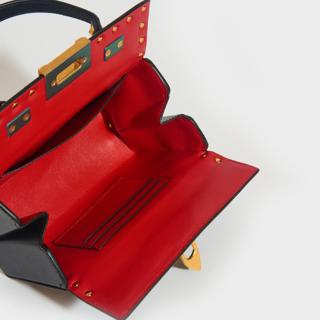 Black handbag red inside on sale